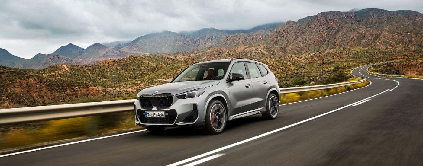 A silver 2026 BMW X1 from the front at an angle.