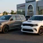 Two 2025 Dodge Durango trim levels parked next to each other on a dealership lot in Woodbury, NJ, highlighting the exterior design differences for South Jersey buyers