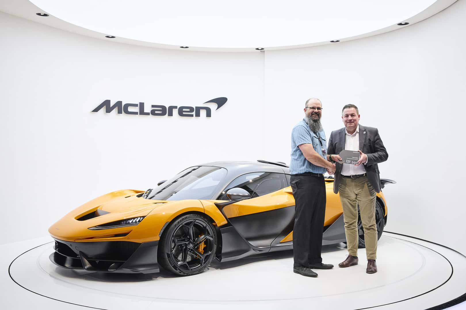 Colin Wells receives an award from McLaren's Steve Robson