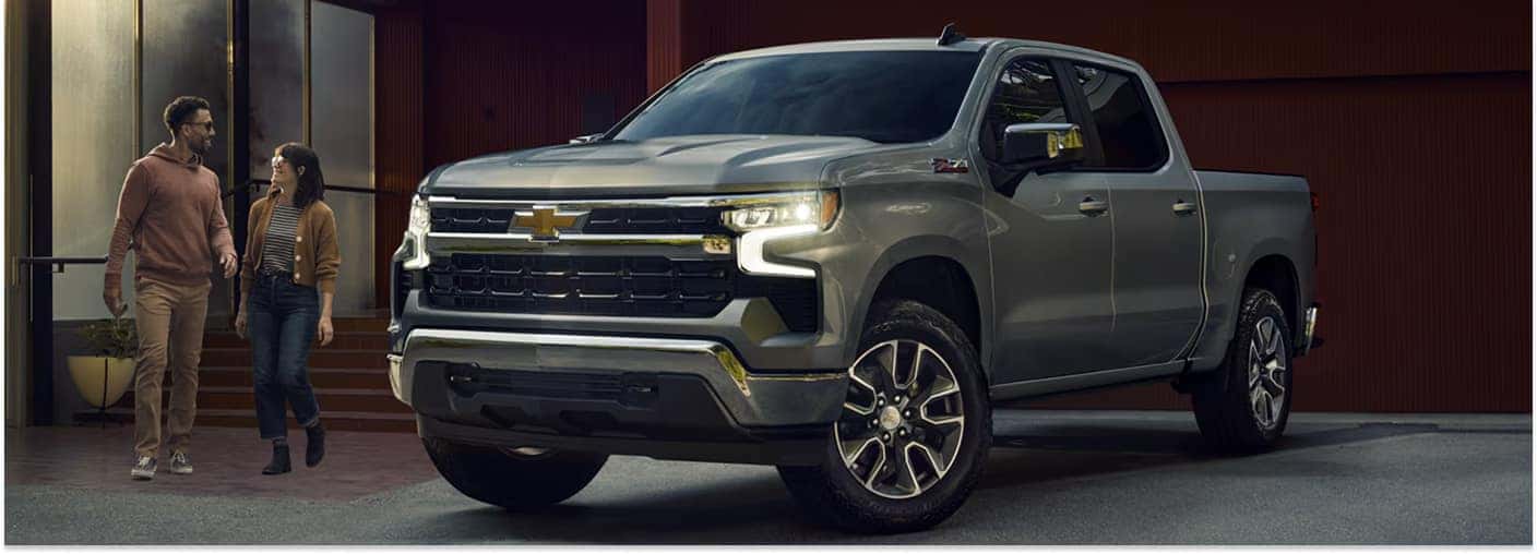 Gray 2026 Chevrolet Silverado 1500 parked in a driveway, viewed from a front three-quarter angle.