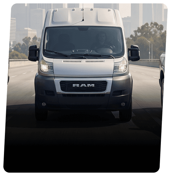 White RAM ProMaster cargo van on a highway